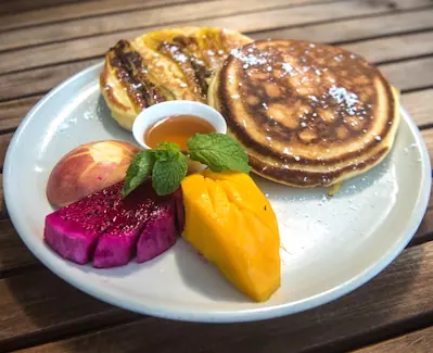 Pancakes with local Cambodian fruits and honey at New Leaf Eatery Siem Reap